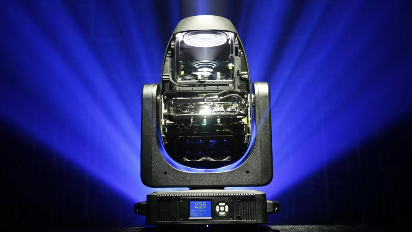 A cutaway view of the LiGHT SKY SUPER SCOPE II moving head stage light, revealing its complex internal optical engine with lenses and effect wheels while projecting a beam of light.